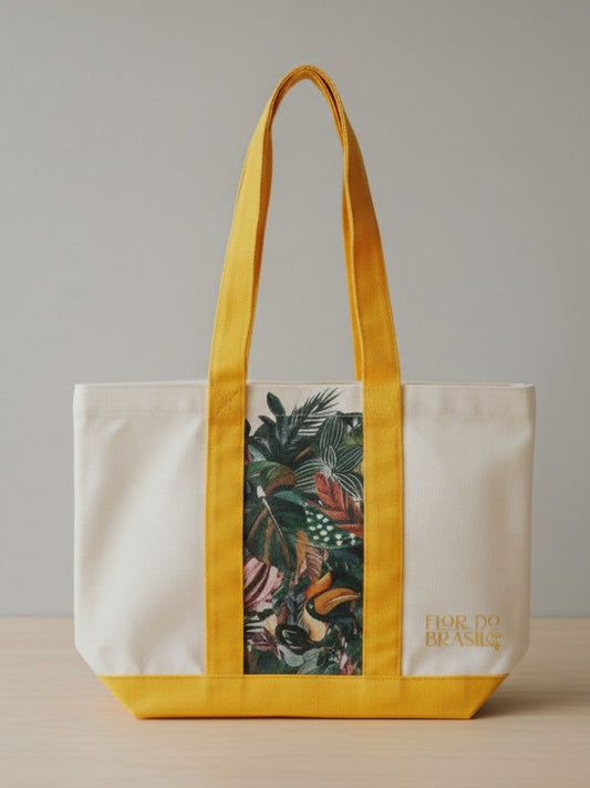 A natural white canvas tote bag with a vibrant yellow base and sturdy yellow shoulder straps